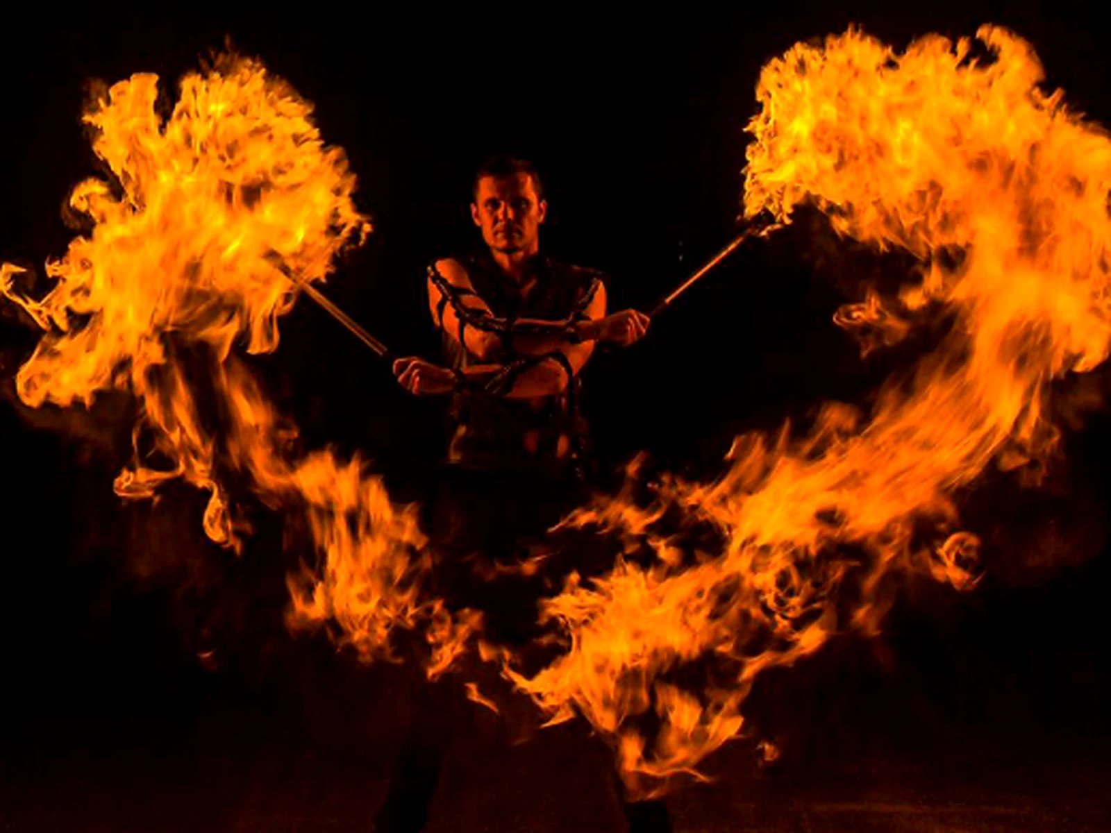 A fire show performer at the desert camp
